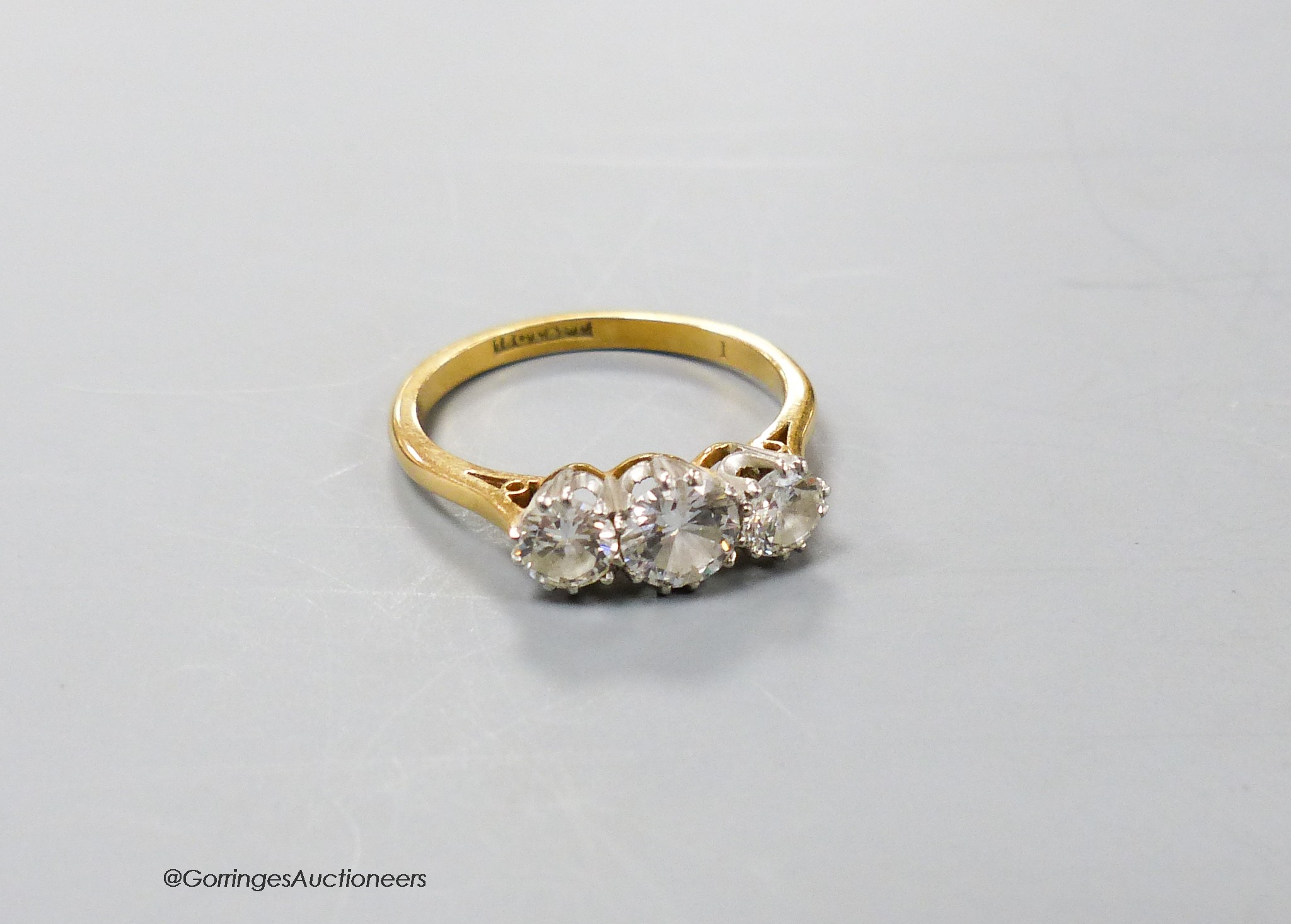 An 18ct & Pt mounted three stone diamond ring, size O, gross 3.2 grams.